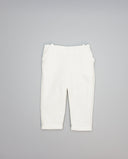 Pantalón de micropana para niña con volante en bolsillos laterales