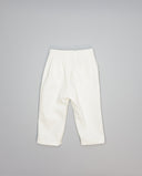 Pantalón de micropana para niña con volante en bolsillos laterales