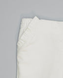 Pantalón de micropana para niña con volante en bolsillos laterales