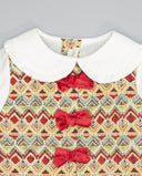 Vestido pichi de tejido tapicero con lazos delanteros
