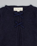 Navy knit cardigan with two small metallic contrast bows
