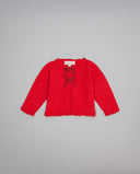 Chaqueta roja de tricot con dos pequeños lazos metalizados a contraste