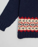 Navy merino wool cardigan with border pattern and coconut buttons
