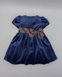 Vestido azul marino de terciopelo con manga farol y lazada