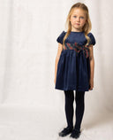 Vestido azul marino de terciopelo con manga farol y lazada