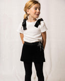 Camisa niña beige de algodón estructurado con lazos de terciopelo negro