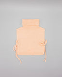 Pink knit vest with wool blend roll neck and side bows