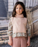 Pink knit vest with wool blend roll neck and side bows