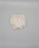 Ranita bombacha bebé niña estampado floral rosa y verde, cintura elástica y volantes, fondo blanco roto