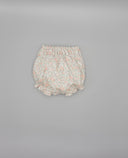 Ranita bombacha bebé niña estampado floral rosa y verde, cintura elástica y volantes, fondo blanco roto