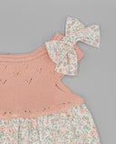 Vestido bebé niña rosa combinado punto tricot y falda floral con lazo, detalle volantes calados primavera