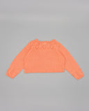 Jersey cropped de punto color salmón para bebé con detalles calados en cuello y puños, manga larga