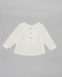 Camisa bebé blanca seersucker manga larga con canesú, botones madera y bolsillo frontal