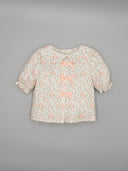 Printed blouse with front bows and puff sleeves