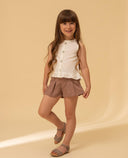 Linen blouse with ruffle hem and mother-of-pearl buttons
