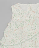 Vestido bebé niña blanco sin mangas estampado floral hojas verdes y flores rosas con volantes Ejerique