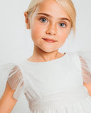 Vestido de tul blanco con chispitas bordadas y mangas mariposa para niña, ideal para comunión o celebración especial.