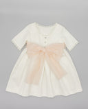 Piqué dress with lace trim and bow