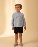 Tailored linen shorts with welt pockets and adjustable waist